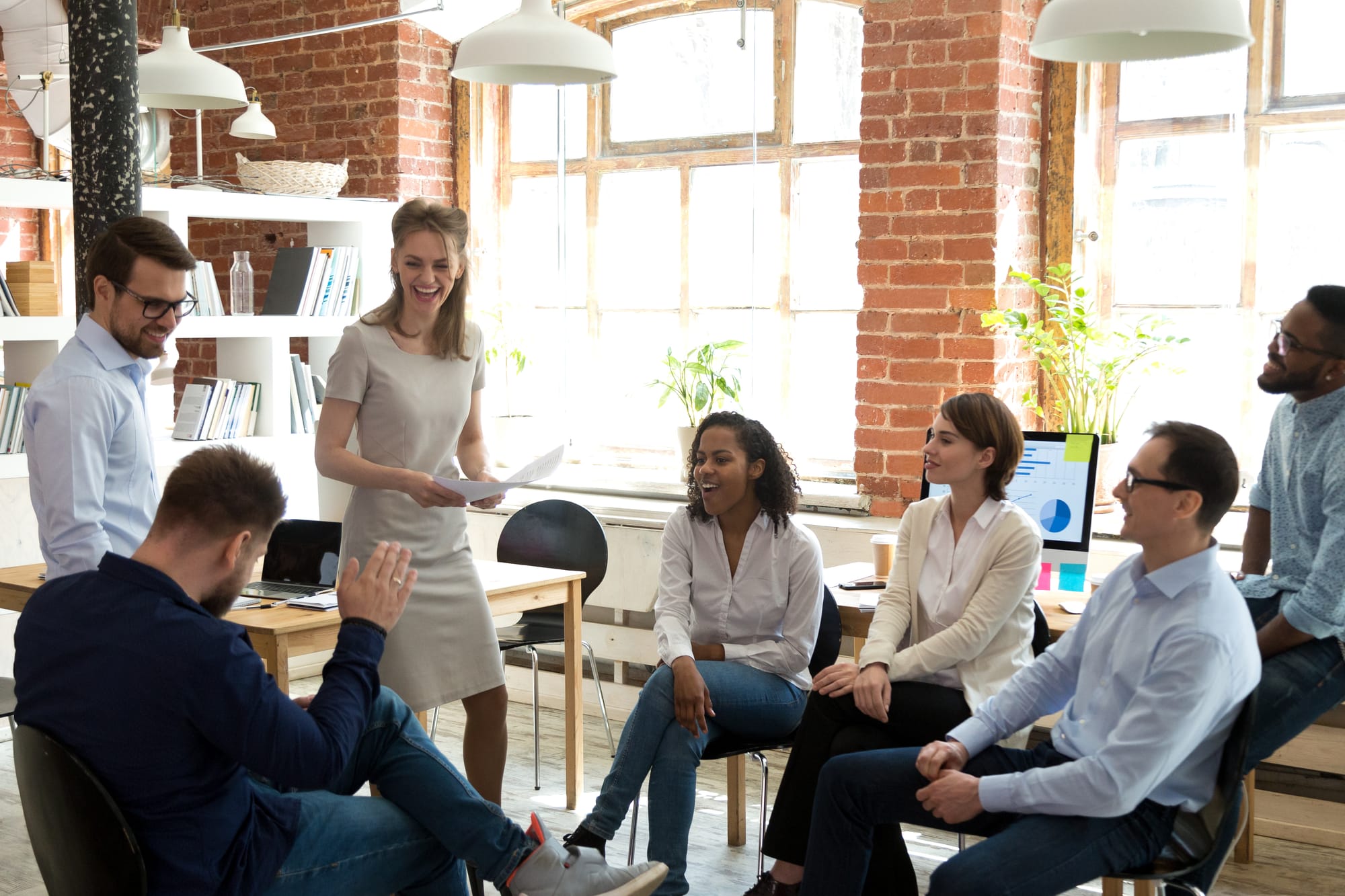 Colleagues in discussion around a meeting table